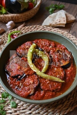 Plate of egyptian mesaka with green pepper on it.