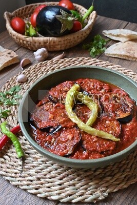 Plate of egyptian mesaka with green pepper on it.