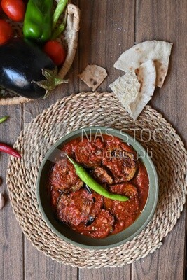 Plate of egyptian mesaka with green pepper on it.