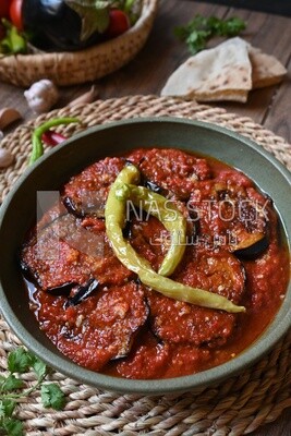 Plate of egyptian mesaka with green pepper on it.