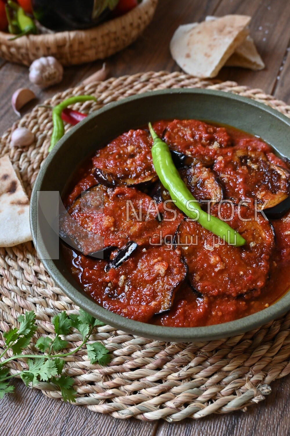 Plate of egyptian mesaka with green pepper on it.