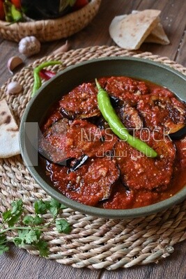 Plate of egyptian mesaka with green pepper on it.