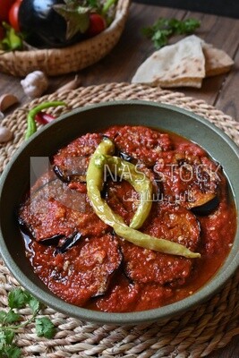 Plate of egyptian mesaka with green pepper on it.