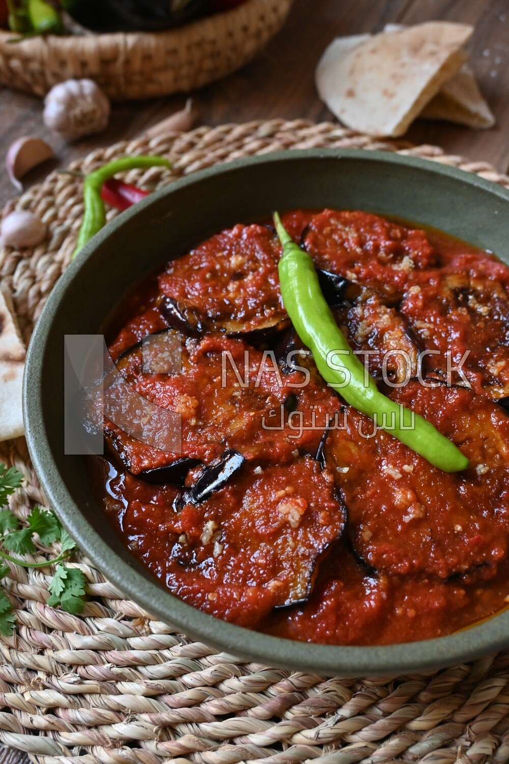 Plate of egyptian mesaka with green pepper on it.