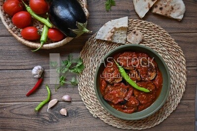 Plate of egyptian mesaka with green pepper on it.