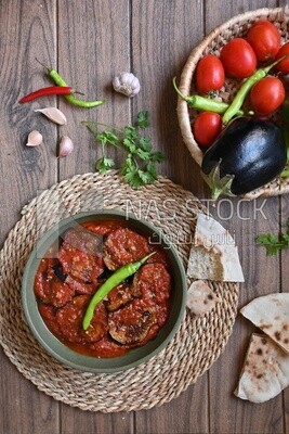 The ingredients of mesaka beside a plate of mesaka