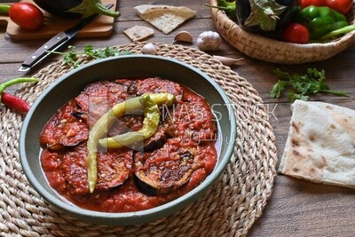 Plate of egyptian mesaka with green pepper on it.