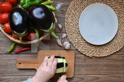Hand cutting the eggplant
