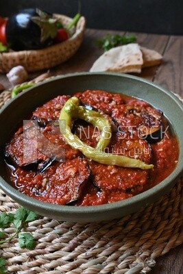 Plate of egyptian mesaka with green pepper on it.