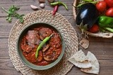 The ingredients of mesaka beside a plate of mesaka