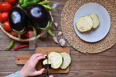 Hand cutting the eggplant