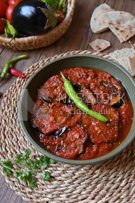 Plate of egyptian mesaka with green pepper on it.