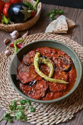 Plate of egyptian mesaka with green pepper on it.