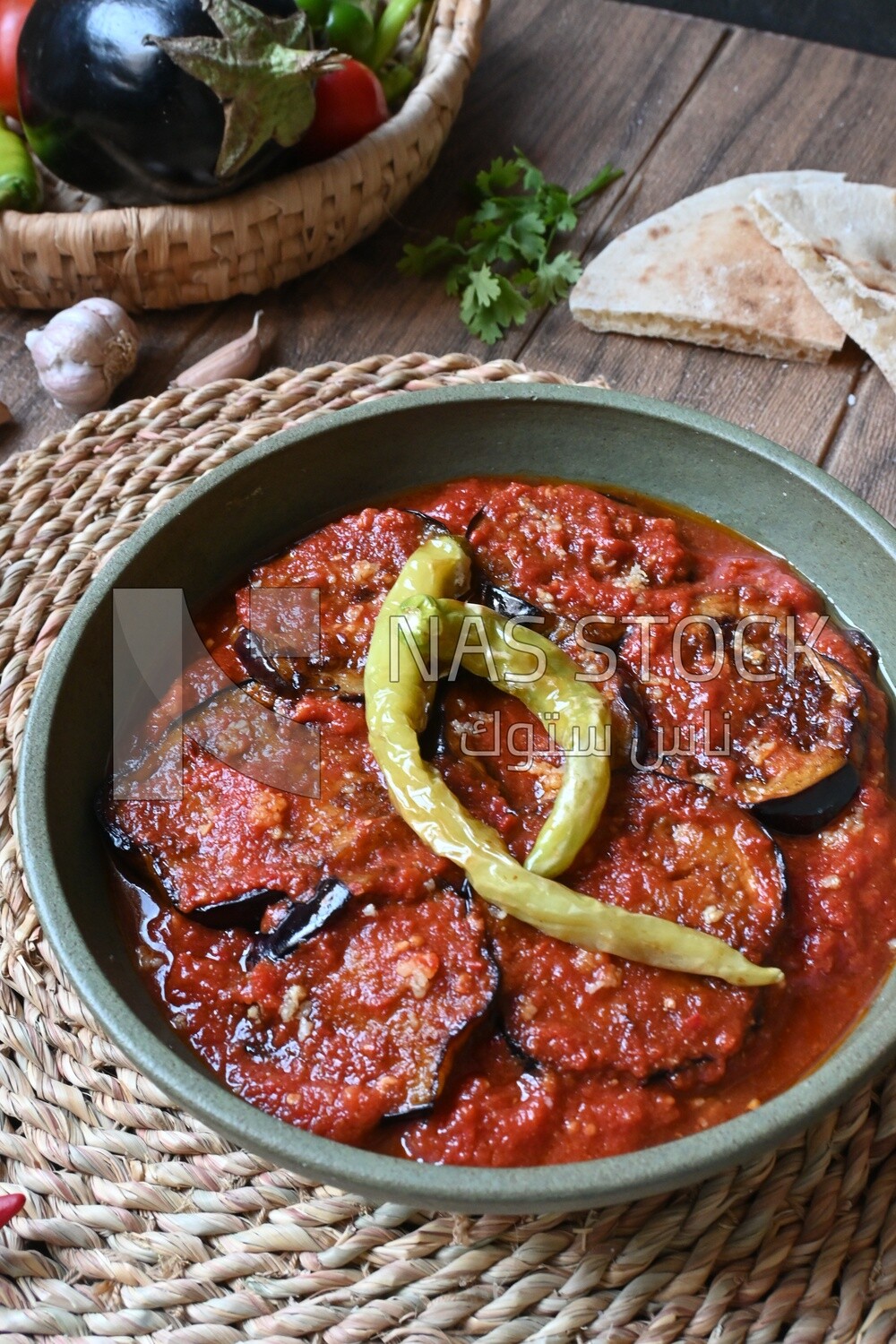 Plate of egyptian mesaka with green pepper on it.