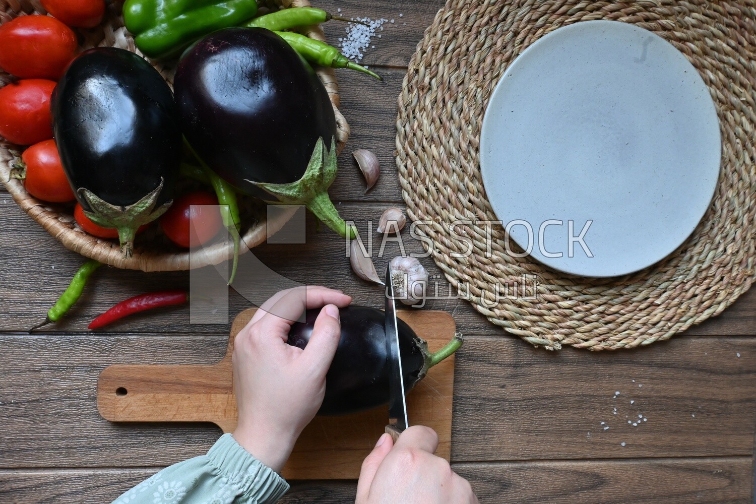 Hand cutting the eggplant