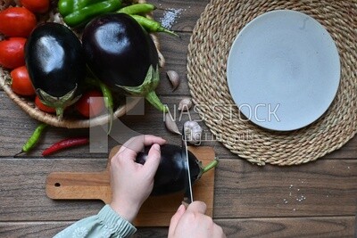Hand cutting the eggplant