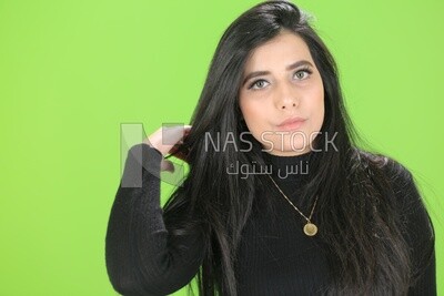 A woman on a green background
