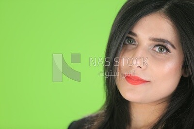 A woman on a green background