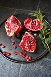 Pomegranates on a black plate​