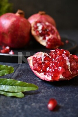 Pomegranates on a black plate​