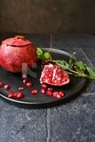 Pomegranates on a black plate​