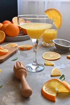 Plate of oranges with a fresh glass of orange juice​