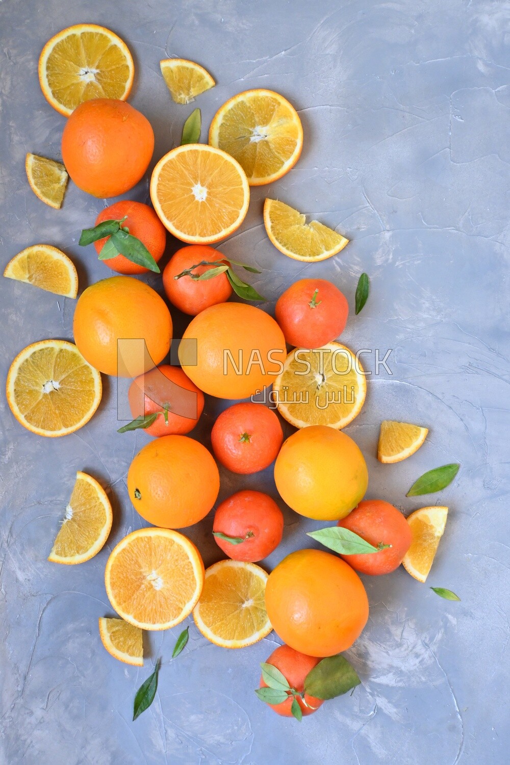 Oranges with orange slices on the table