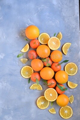 Oranges with orange slices on the table​