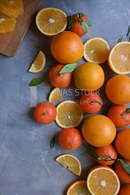 Oranges with orange slices on the table​