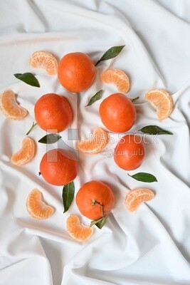 Tangerine with tangerine slices on a white background