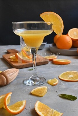 Plate of oranges with a fresh glass of orange juice​