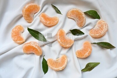 Tangerine slices on a white background