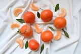 Tangerine with tangerine slices on a white background