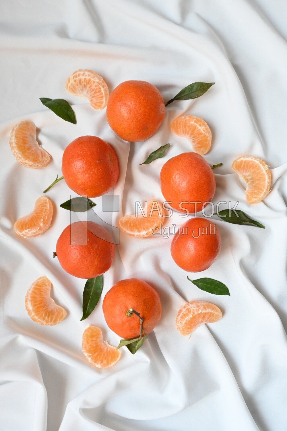 Tangerine with tangerine slices on a white background