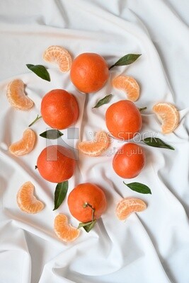 Tangerine with tangerine slices on a white background