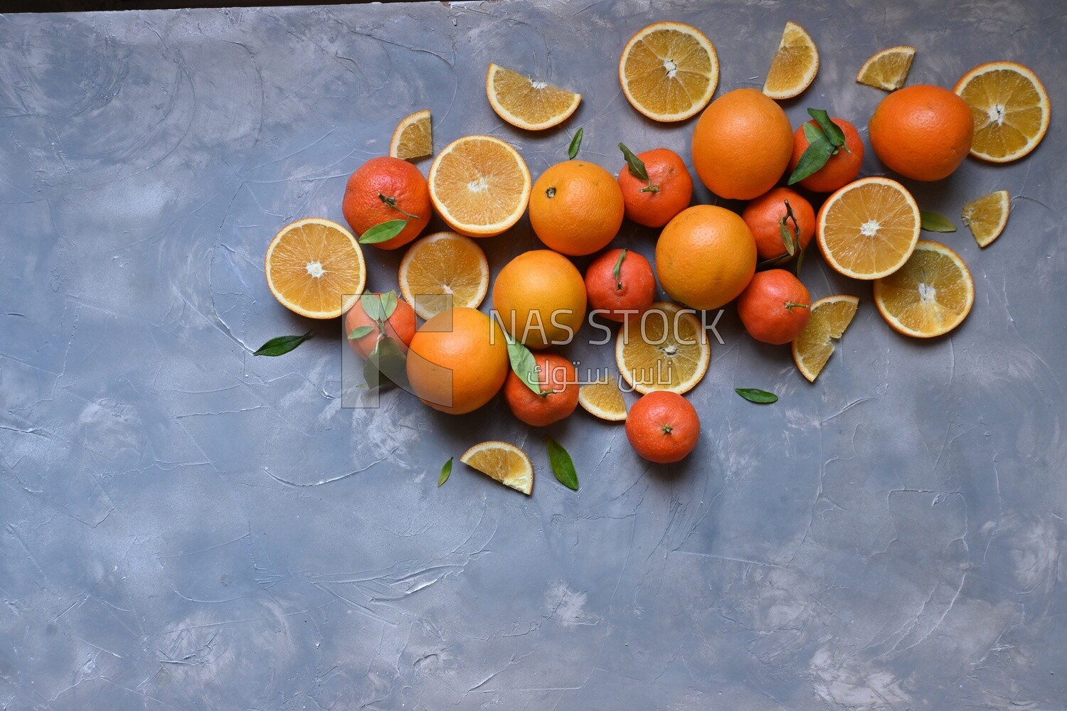 Oranges with orange slices on the table​