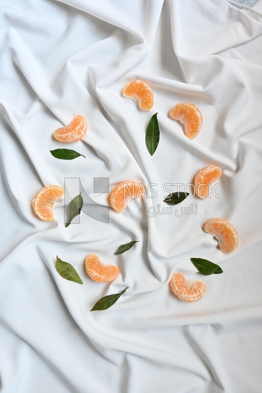 Tangerine slices on a white background