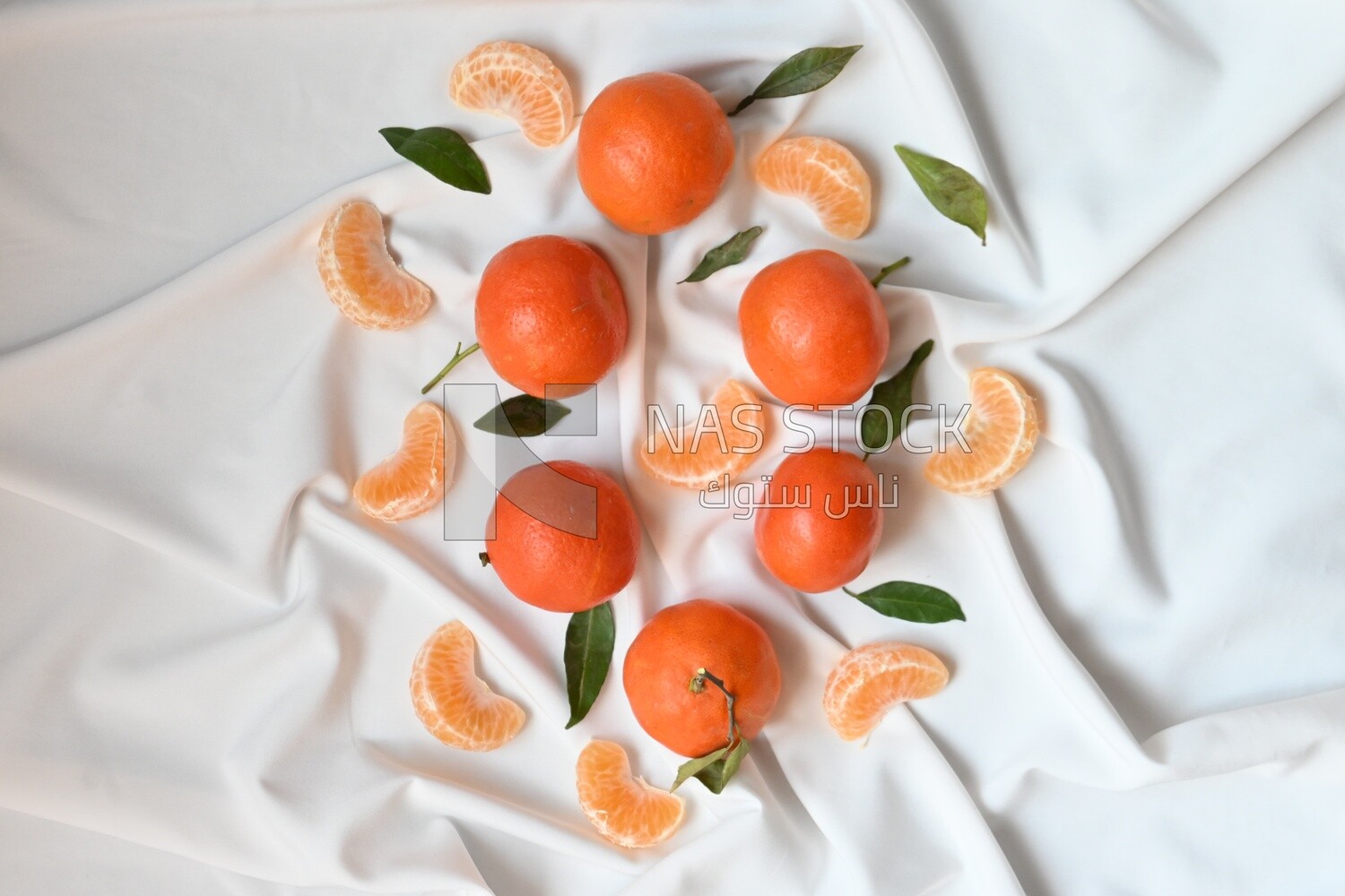 Tangerine with tangerine slices on a white background