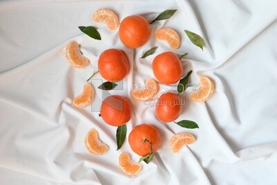 Tangerine with tangerine slices on a white background