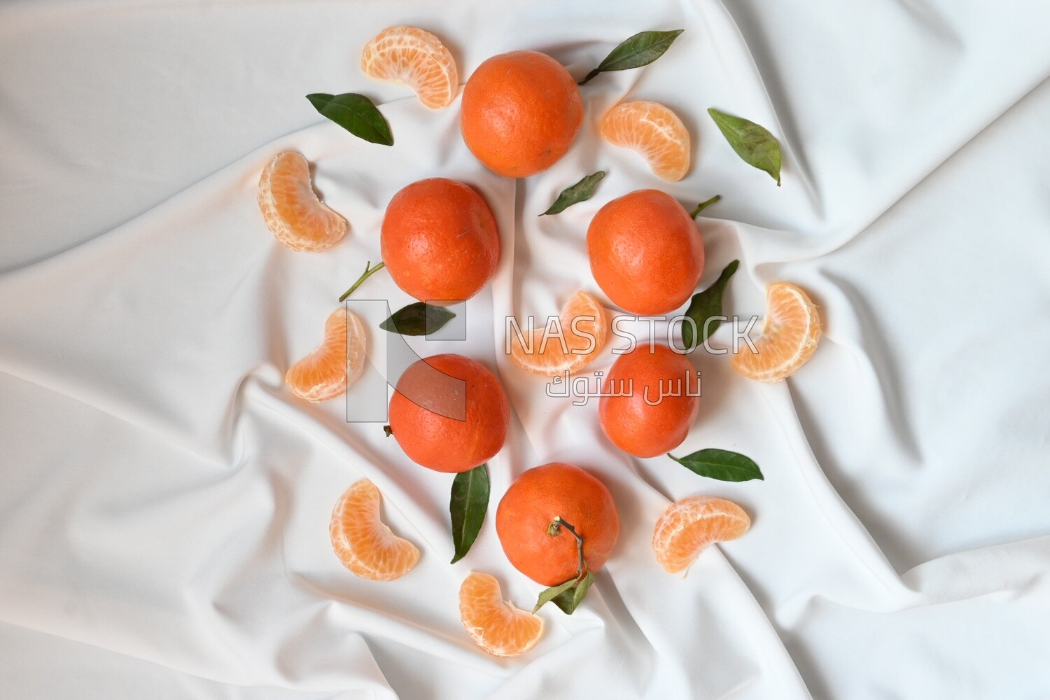 Tangerine with tangerine slices on a white background