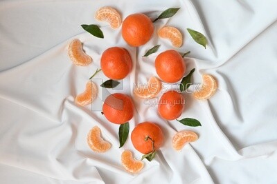Tangerine with tangerine slices on a white background