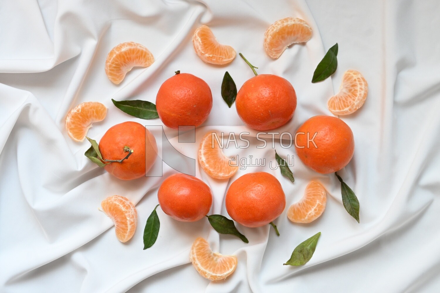 Tangerine with tangerine slices on a white background