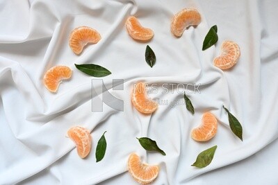 Tangerine slices on a white background​