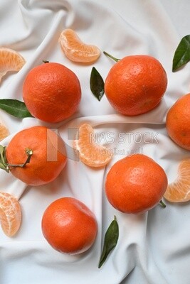 Tangerine with tangerine slices on a white background