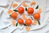 Tangerine with tangerine slices on a white background