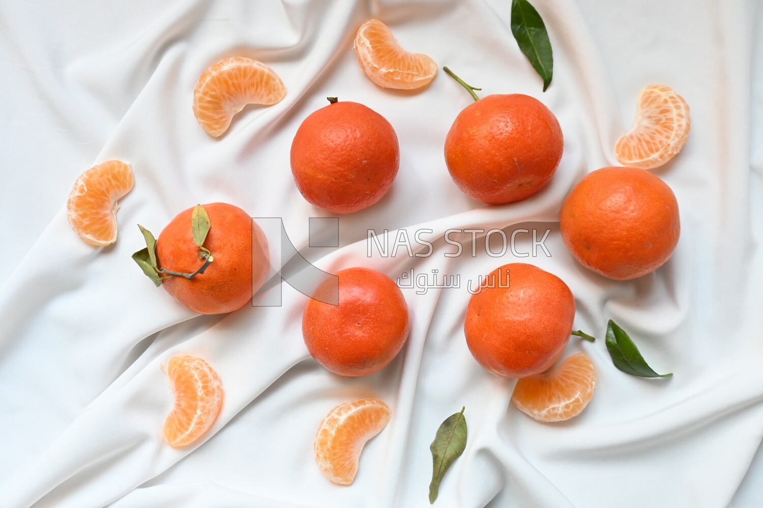 Tangerine with tangerine slices on a white background