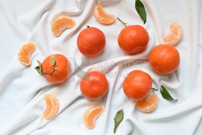 Tangerine with tangerine slices on a white background