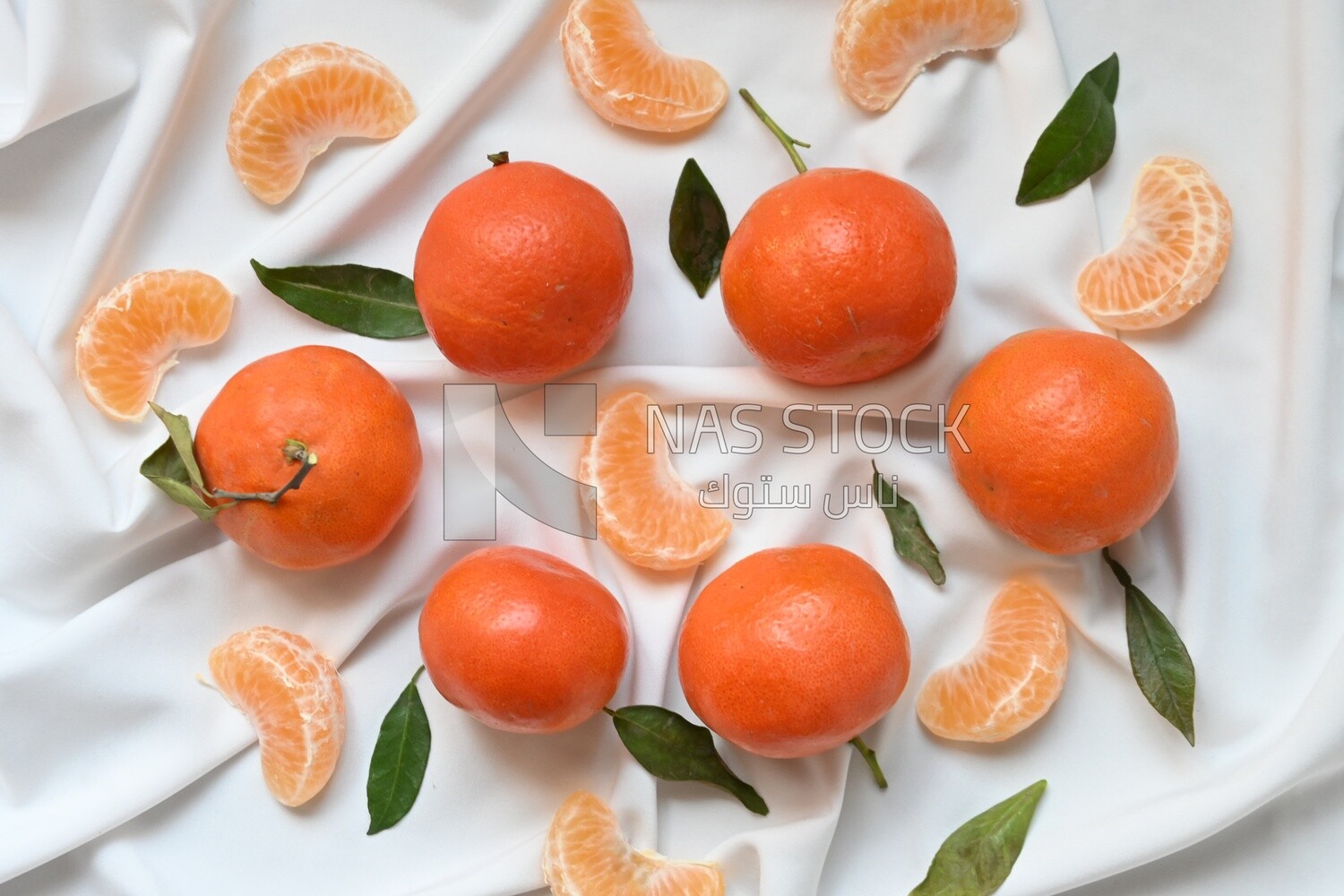 Tangerine with tangerine slices on a white background