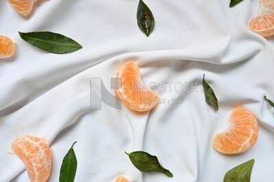 Tangerine slices on a white background​