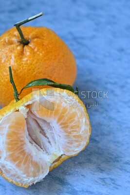 Tangerine on a blue background
